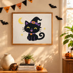 Finished Smiling Witch Kitten punch needle canvas on a wall