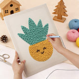 Punching the Smiling Yellow Pot design with the punch needle