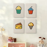 The four Snack Time Treats mini canvases on a wall above a shelf