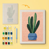 Snake Plant on Peach canvas before and after punching, with the threads and tools