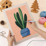 Punching the Snake Plant on Peach design with the punch needle