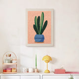 Finished Snake Plant on Peach punch needle canvas on a wall