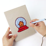 Punching a Snow Globe Christmas mini canvas with the punch needle