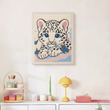 Finished Snow Leopard Cub punch needle canvas on a wall