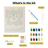 What is in the Snowy Ginger Cuddle kit: printed canvas, punch needle, threader, threads, color guide and hangers