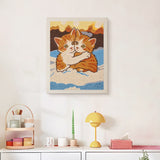 Finished Snowy Ginger Cuddle punch needle canvas on a wall