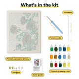 What is in the Snowy Red Roses kit: printed canvas, punch needle, threader, threads, color guide and hangers