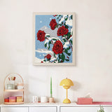 Finished Snowy Red Roses punch needle canvas on a wall