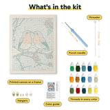 What is in the Snowy Robin Pair kit: printed canvas, punch needle, threader, threads, color guide and hangers