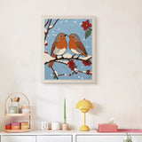 Finished Snowy Robin Pair punch needle canvas on a wall