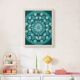 Finished Soft Teal Mandala punch needle canvas on a wall