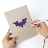 Punching a Spider and Broom mini canvas with the punch needle