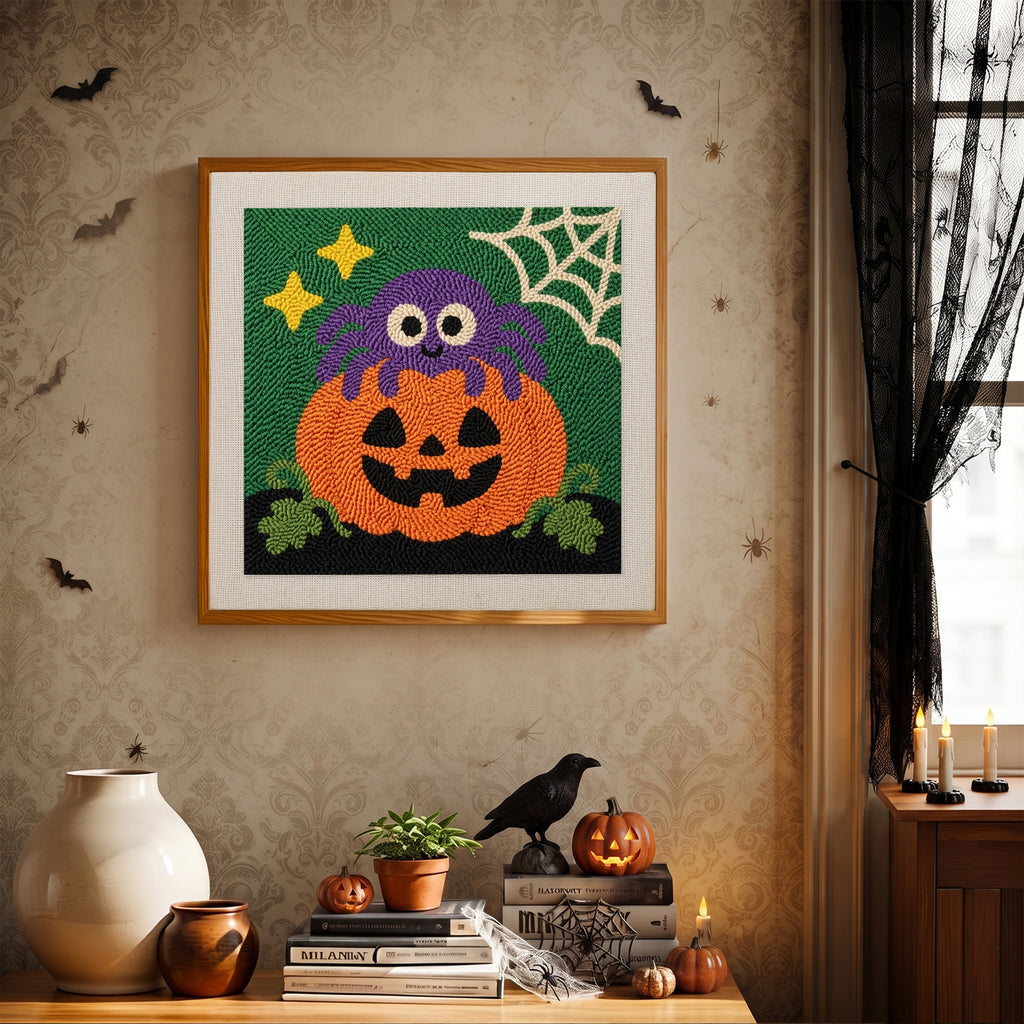 Finished Spider on a Pumpkin punch needle canvas on a wall