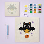 Star Bat Cat canvas before and after punching, with the threads and tools