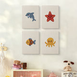 The four Starfish and Octopus mini canvases on a wall above a shelf