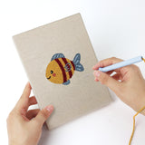 Punching a Starfish and Octopus mini canvas with the punch needle