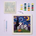 Starry Graveyard Ghosts canvas before and after punching, with the threads and tools