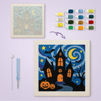 Starry Haunted Manor canvas before and after punching, with the threads and tools