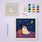 Starry Night Ghost canvas before and after punching, with the threads and tools