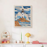 Finished Stormy Lighthouse punch needle canvas on a wall