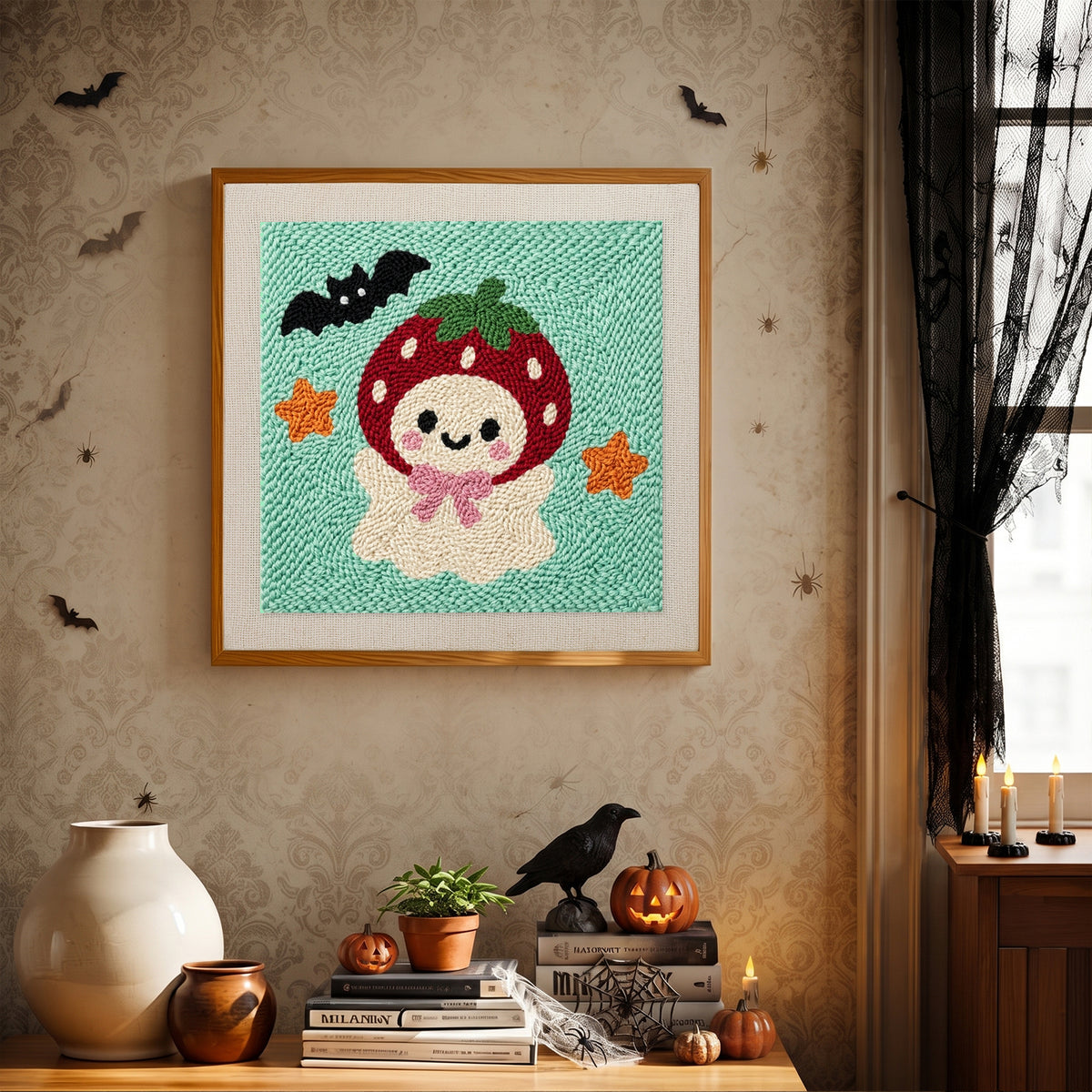 Finished Strawberry Ghost punch needle canvas on a wall