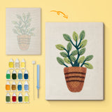 Striped Pot Plant canvas before and after punching, with the threads and tools