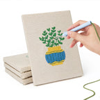 Hand punching one of the Striped Pot Plants mini canvases