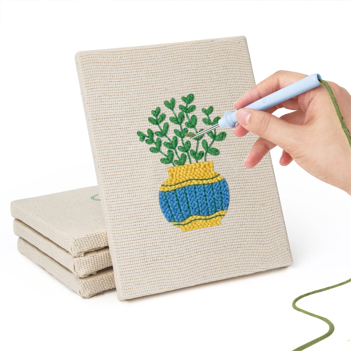 Hand punching one of the Striped Pot Plants mini canvases