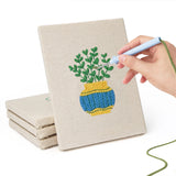 Hand punching one of the Striped Pot Plants mini canvases