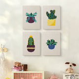 The four Succulent Shelf mini canvases on a wall above a shelf