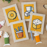 The four finished Sugar Cube Donut mini canvases laid out on a table