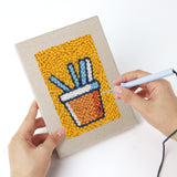 Punching a Sugar Cube Donut mini canvas with the punch needle