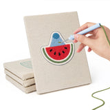 Hand punching one of the Summer Coolers mini canvases