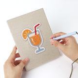 Punching a Summer Coolers mini canvas with the punch needle