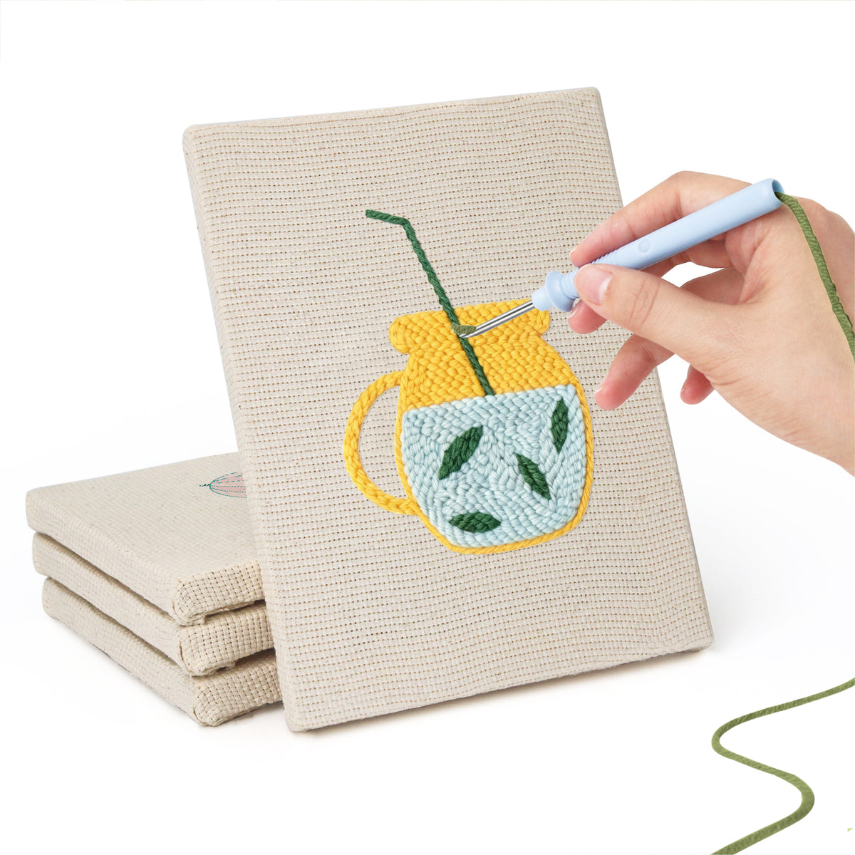 Hand punching one of the Summer Sips mini canvases