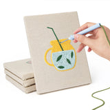 Hand punching one of the Summer Sips mini canvases