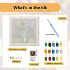 What is in the Sunflower Bone Hand kit: printed canvas, punch needle, threader, threads, color guide and hangers