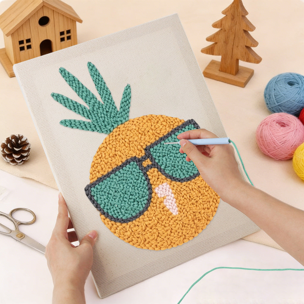 Punching the Sunglasses Pineapple design with the punch needle