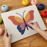 Punching the Sunset Butterfly design with the punch needle