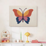 Finished Sunset Butterfly punch needle canvas on a wall