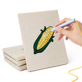 Hand punching one of the Sweet Corn Harvest mini canvases