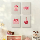 The four Sweetheart Charms mini canvases on a wall above a shelf