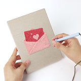 Punching a Sweetheart Charms mini canvas with the punch needle