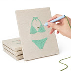 Hand punching one of the Swimsuit Season mini canvases