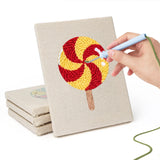 Hand punching one of the Swirl Lollipops mini canvases