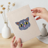 Hand holding a finished Tabby Cat Faces mini canvas