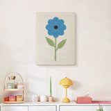 Finished Tall Blue Flower punch needle canvas on a wall
