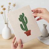 Hand holding a finished Tall Potted Cacti mini canvas