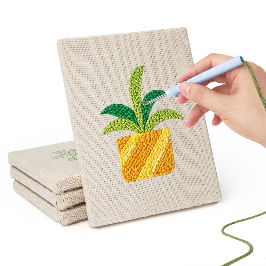 Hand punching one of the Teacup Succulents mini canvases