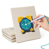 Hand punching one of the Teal Alarm Clock mini canvases
